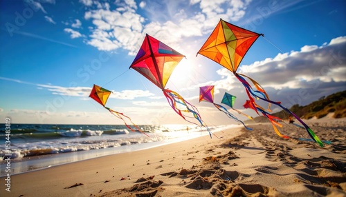Colorful kites soaring above a sandy beach during sunset with waves gently crashing