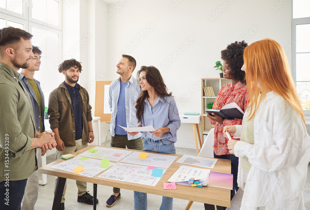 Obraz premium Coworkers collaborate on paperwork and creation of a business plan during a meeting or conference in the office. The team focuses on accounting and business planning, working professionally together.