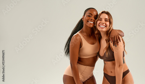 Bild auf Leinwand Confident diverse women in nude underwear smiling in studio