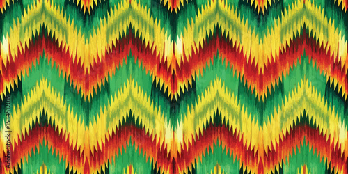 Vibrant zigzag pattern in green, yellow, and red colors, creating a lively textile design.