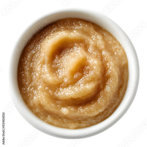 Overhead view of creamy homemade applesauce served in a white ceramic bowl with a natural light look isolated on white transparent