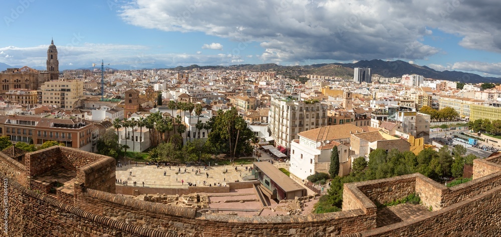 Obraz premium Teatro Romano or Roman Theatre Panoramic Aerial View, Famous Ancient Alcazaba Fortress Ruins, Distant Malaga, Spain Andalucian City Skyline