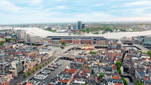 Photography Aerial view of Amsterdam's Train station and canals
