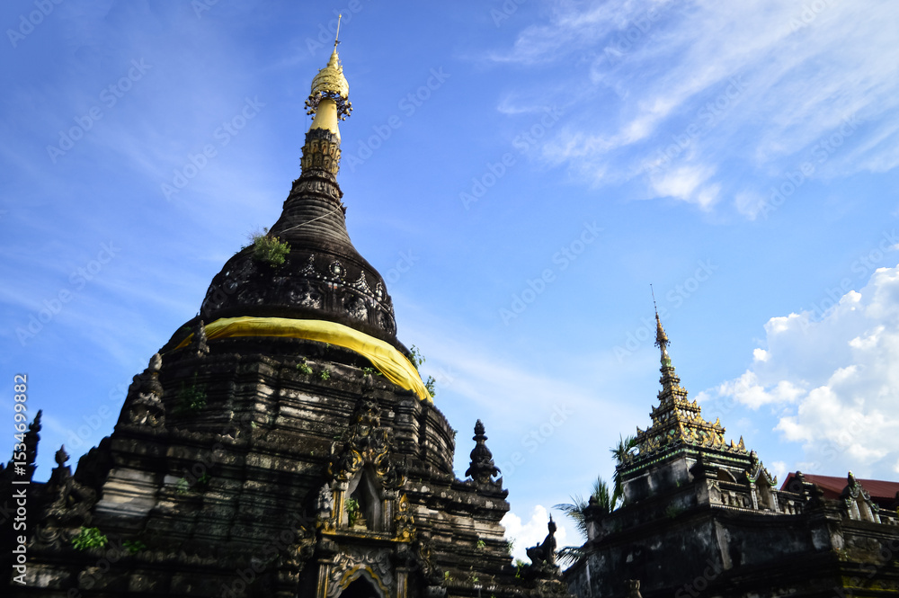 Fototapeta premium Old Pagoda in the Evening, Ancient Architecture, Symbols of Buddhism, South East Asia at Pa Pao temple, Mueang Chiang Mai, Chiang Mai, Northern Thailand