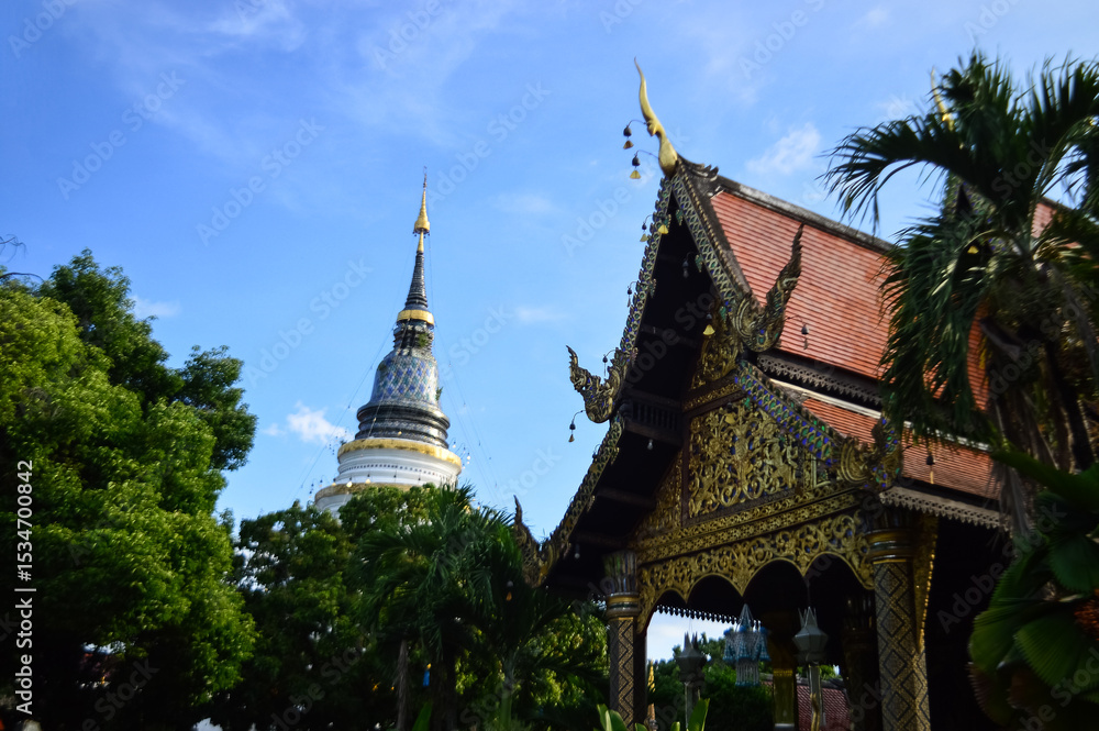 Fototapeta premium Pagoda and Chapel, Lanna Architecture, Symbols of Buddhism, South East Asia at Ket Karam temple, Mueang Chiang Mai, Chiang Mai, Northern Thailand