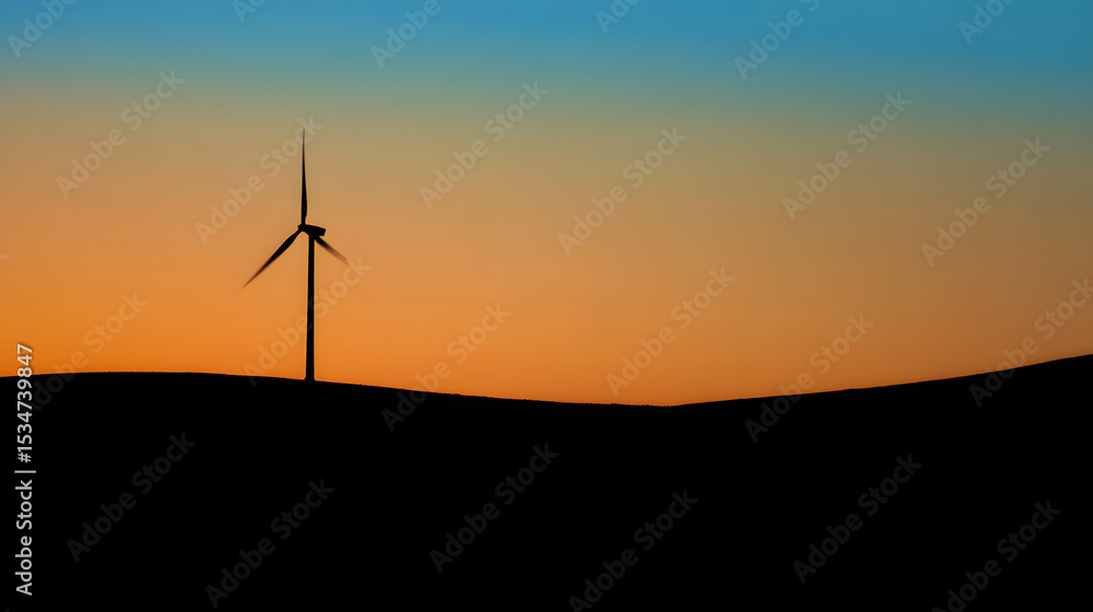 Obraz premium Wind turbine against sunset sky, symbolizing clean energy and sustainable future
