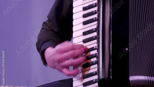 Musician playing the accordion. Close-up of hands.
