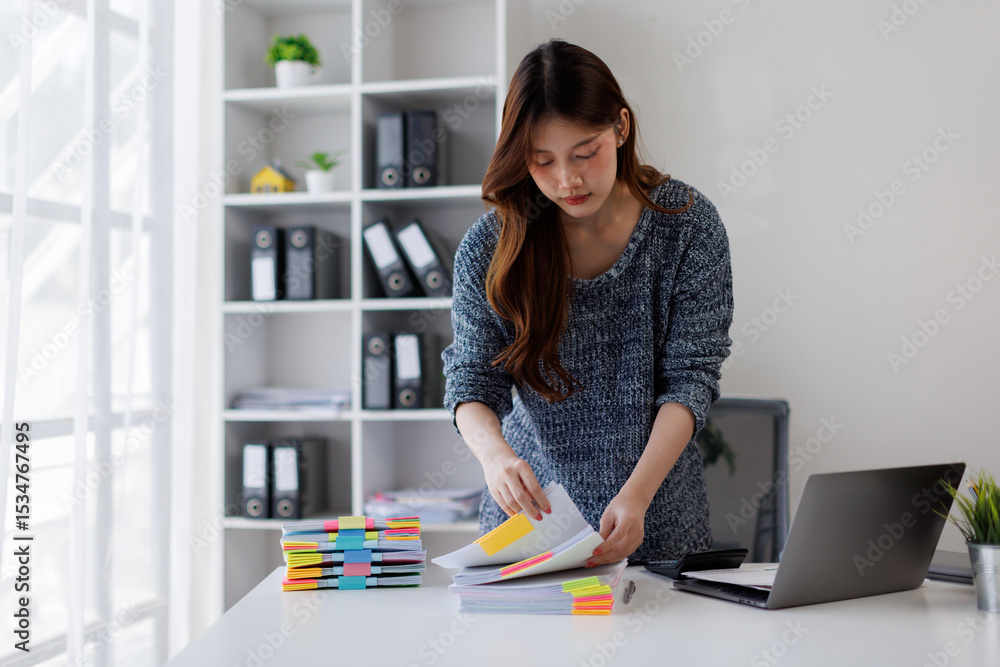 Business woman working at office with documents on his desk, doing planning analyzing the financial report, business plan investment, finance analysis concept Business woman working at office with documents on his desk, doing planning analyzing the financial report, business plan investment, finance analysis concept