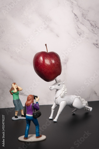 Obraz na plátně photographer photographs unicorn in front of shocked bystander