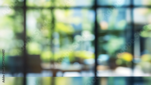 Wallpaper Mural A tranquil garden scene viewed through a large window, blurred into a soft, dreamy bokeh of greens and blues Torontodigital.ca