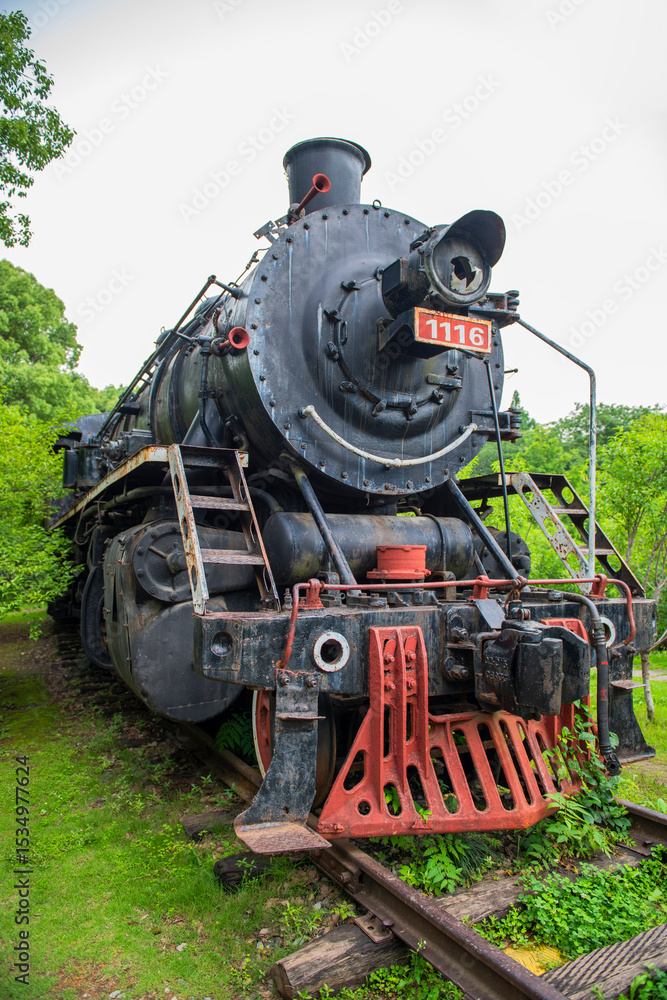 Fototapeta premium Parked vintage old black steam locomotive