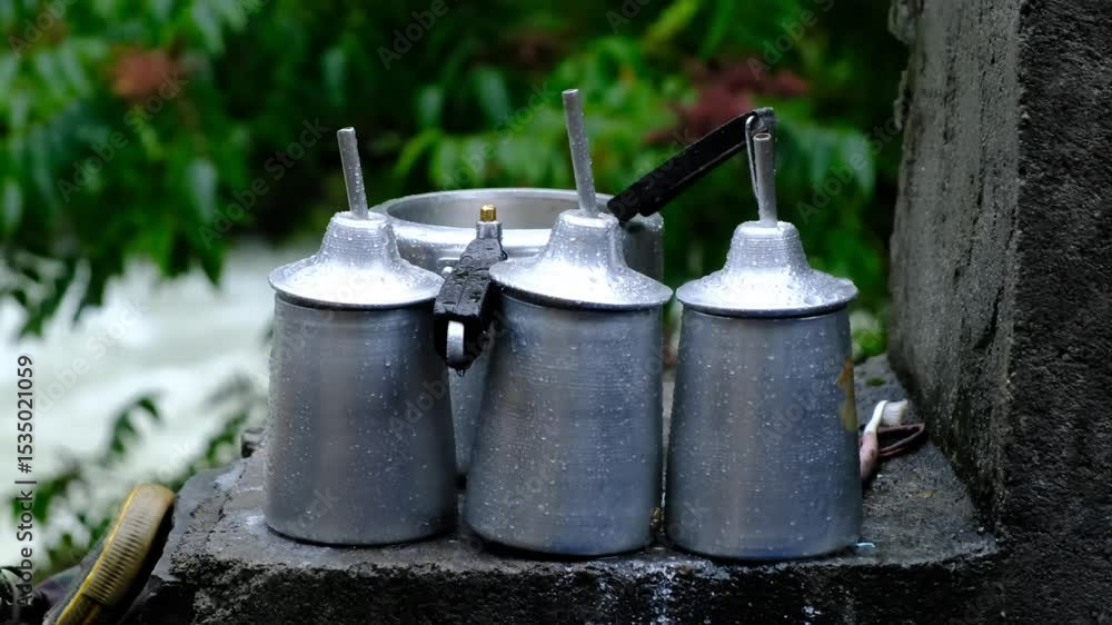 Rain Falling on Aluminum Teapots
Rain Falling on Aluminum Teapots