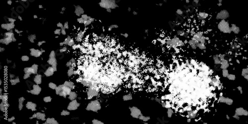 Snowflakes on dark background. white icy snowflakes isolated on black background, natural background. white crystalline powder on a black background. sugar dust. texture, pattern and clipping.