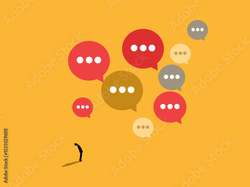 Small businessman stands looking at a lot of criticism
