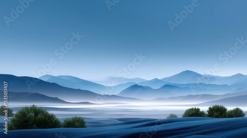 Serene blue landscape with rolling hills and distant mountains at dawn.