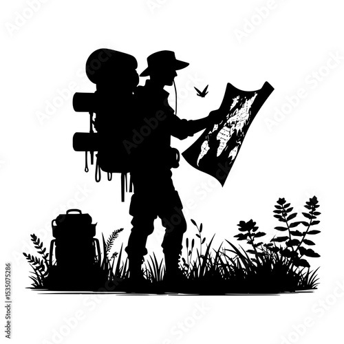 Silhouette of backpacker studying a map outdoors