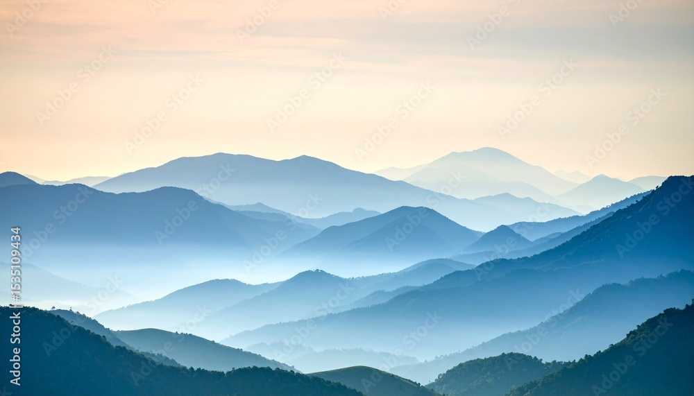 Obraz premium Serene Blue Mountain Range Landscape at Sunrise Peaceful Nature Scenery.