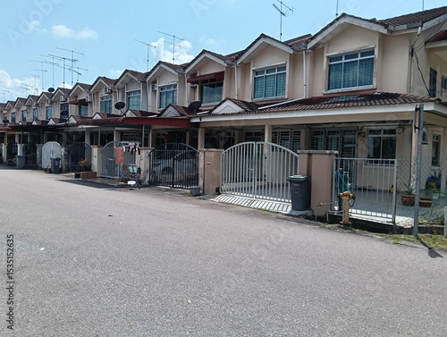 A row of houses in the middle of a street in the city in kluang, johor, malaysia. Residential area