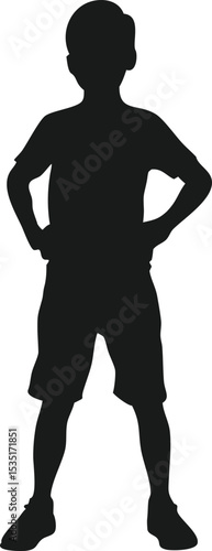 Young boy standing with hands on hips silhouette