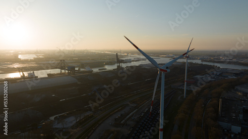 Canvas Print wind turbine in the port of Amsterdam, showcasing heavy industry, transport over water and renewable energy