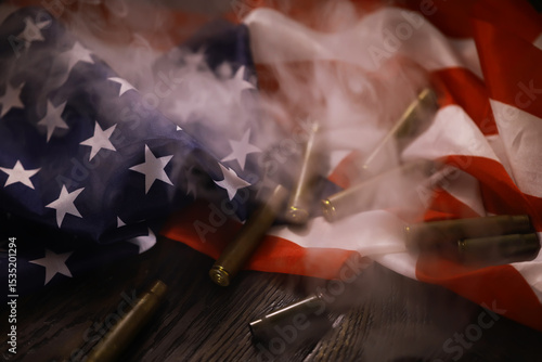 Photos American Flag with Bullet Casings and Smoke Symbolizing Conflict and Patriotism