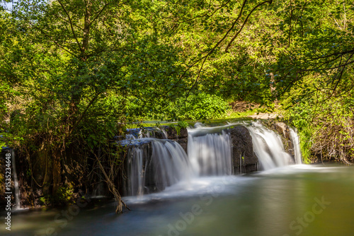 Monte Gelato waterfall surrounded by lush greenery and tranquility in Mazzano Romano, Lazio.
