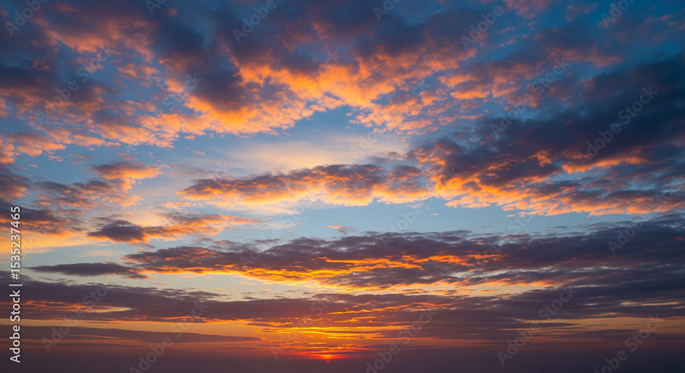 Obraz premium Natural blue sky with soft white clouds in daylight, featuring authentic cloud formations and clean atmosphere, ideal for backgrounds, weather visuals, or serene outdoor scenes