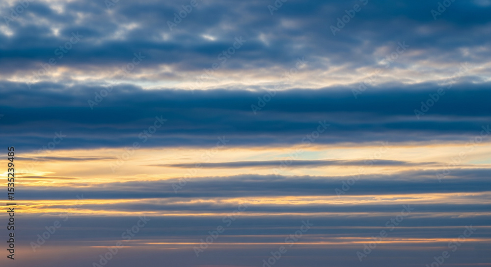 Obraz premium Natural blue sky with soft white clouds in daylight, featuring authentic cloud formations and clean atmosphere, ideal for backgrounds, weather visuals, or serene outdoor scenes