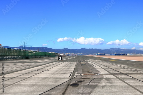 the empty runway at Gibraltar Airport with view to the sea