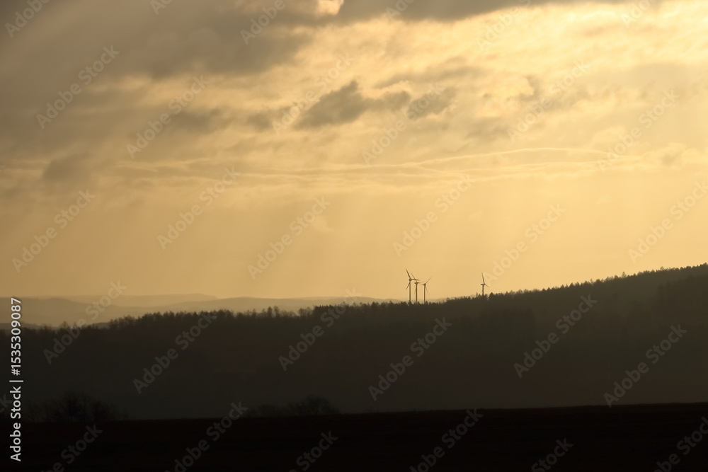 Naklejka premium Aerial view of powerful Wind turbine farm for green energy production in Saxony, Germany, Europe