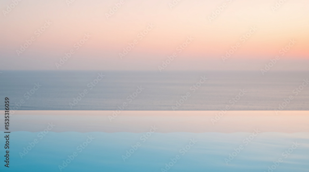 Fototapeta premium Infinity pool with calm water reflecting the serene sky at sunset.