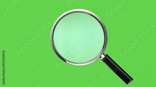 Magnifying glass focusing light beam on green screen background