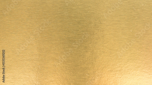 Gradation gold foil leaf shiny matt with sparkle yellow metallic texture background.
Abstract paper glitter golden glossy for template.
top view.