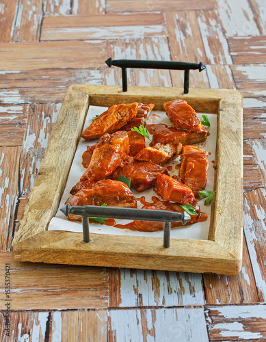 Bild auf Leinwand oven baked country style ribs in tossed with a spicy bbq sauce