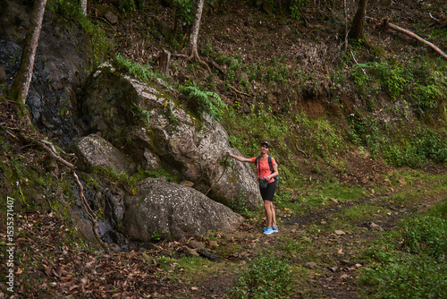 Wallpaper Mural Beautiful European woman hiking in La Vallée de Ferney, Mauritius. Outdoor adventure in lush tropical forest with scenic mountain views. Active lifestyle and nature exploration. Torontodigital.ca