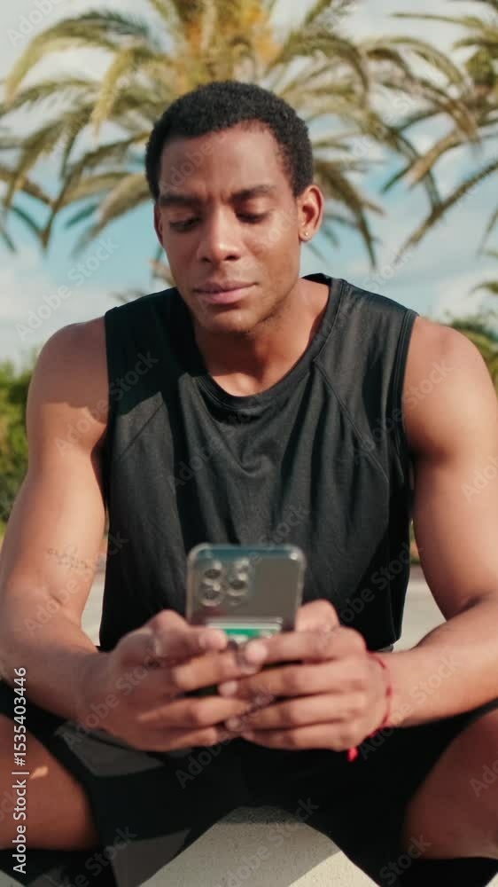 Vertical video, Man Checking Phone After Fitness Workout Vertical video, Man Checking Phone After Fitness Workout