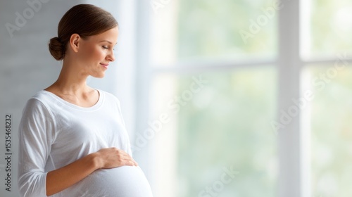 Pregnant Woman Gently Touching Belly in White Shirt Free Download Pregnant Woman Gently Touching Belly in White Shirt - GFXLoad
