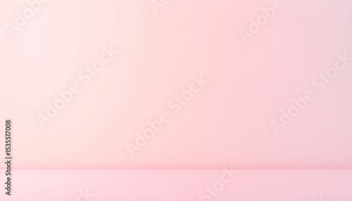 A soft pink gradient wall and floor create a minimalist, empty studio space.
