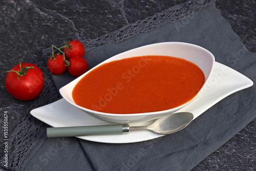 Fototapeta Naklejka Na Ścianę i Meble -  A white bowl of tomato soup.
