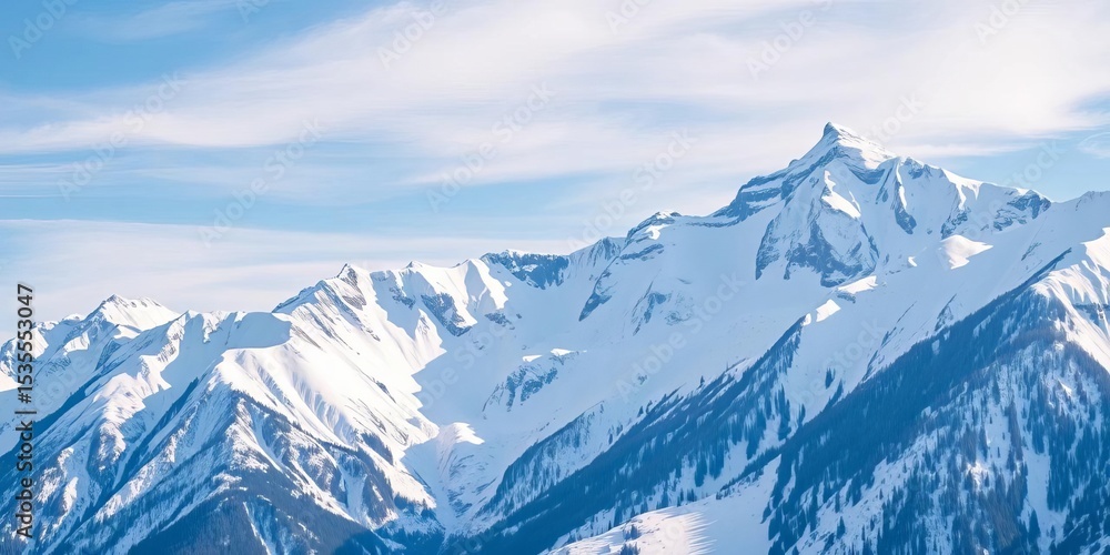 Fototapeta premium Majestic snow-capped mountain range under a clear winter sky , vista, mountain range