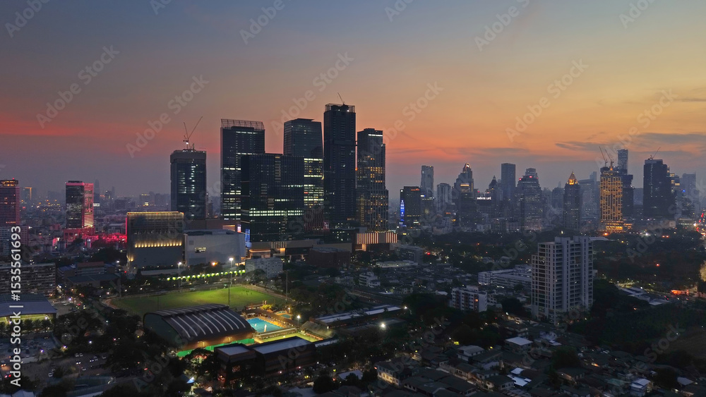 Fototapeta premium Illuminated skyscrapers and Lumpini park in Bangkok