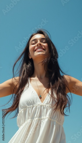 Joyful woman embracing the sun