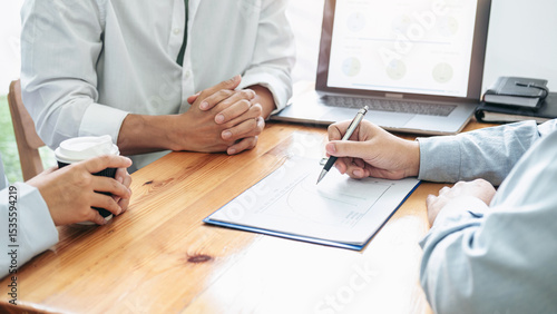 Asian couple meeting with financial advisor to analysis and discussion about investment of new business