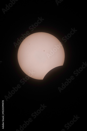 Solar Eclipse with visible sunspots