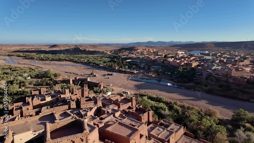 Ouarzazate, Morocco: Panoramic aerial footage of the famous Aït Benhaddou, or Ben Haddou, ksar, a fortified village for its hill top ancient fort near Ouarzazate in the Moroccan atlas. 