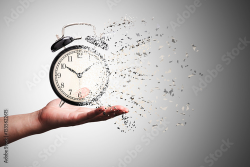 Retro black alarm clock dissolving into a little particles for time can not return and never wait anyone , Time management concept.