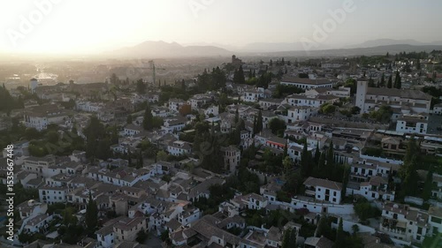Wallpaper Mural Aerial view from a drone of Granada's old town and city skyline under a clear summer sky. Captures historic architecture, rooftops, and urban landscape of southern Spain. Torontodigital.ca