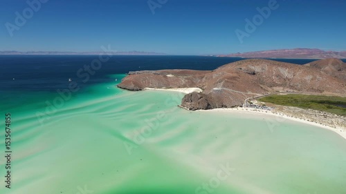 Aerial view of turquoise water and white sand beach at Balandra beach in La Paz, Baja California Sur, Mexico