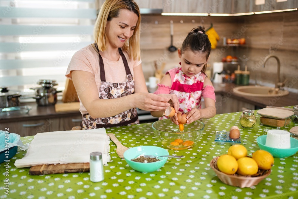 Cooking joyfully together in a cozy kitchen with fresh ingredients Cooking joyfully together in a cozy kitchen with fresh ingredients