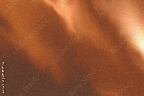 Soft Blurred Orange Brown Grainy Marble Texture with Light Glow Background